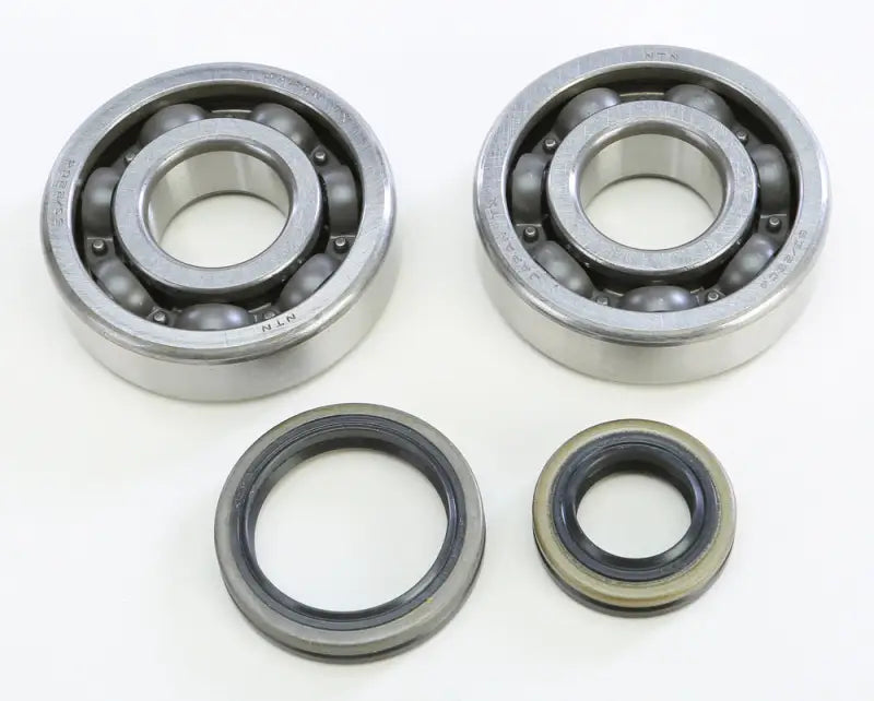 Two ball bearings and oil seals from the 23.CBS32099 Crankshaft Bearing & Seal Kit Suz, perfect RV parts & accessories