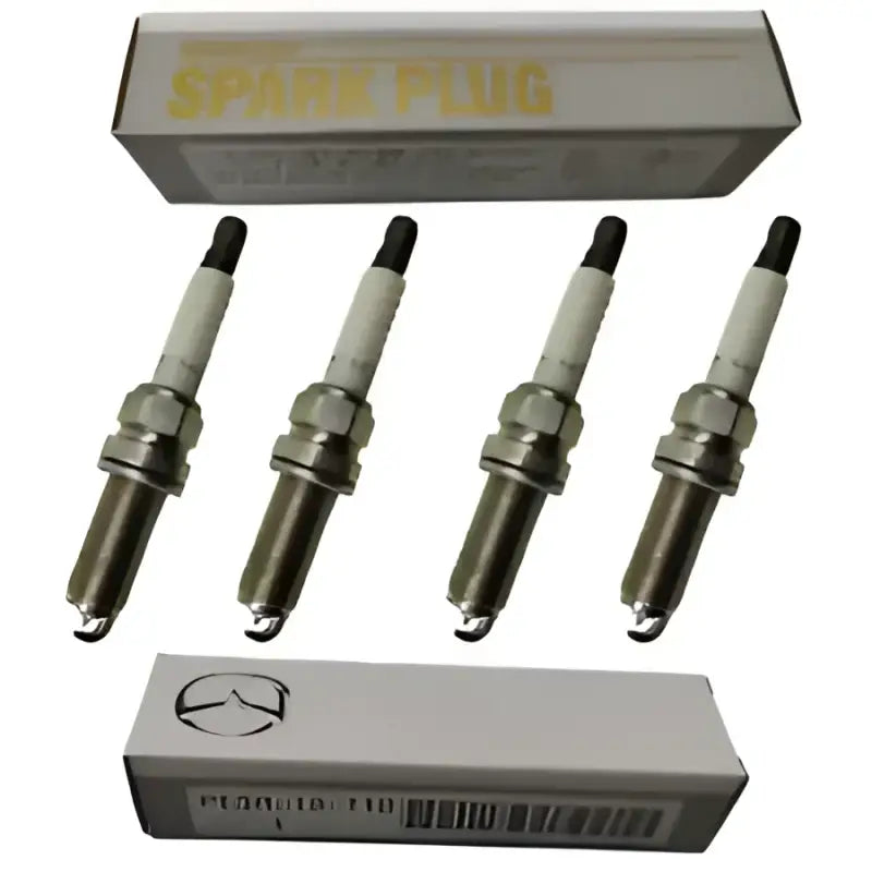 Four NGK Mazda spark plugs with boxes for fuel efficiency in Mazda 3 2014-2016