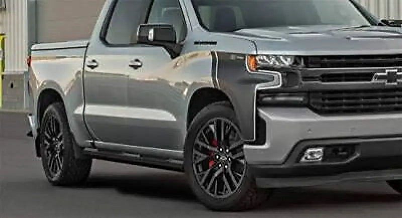 Silver Chevrolet pickup truck with Maxway Octa Series step bar for easy access