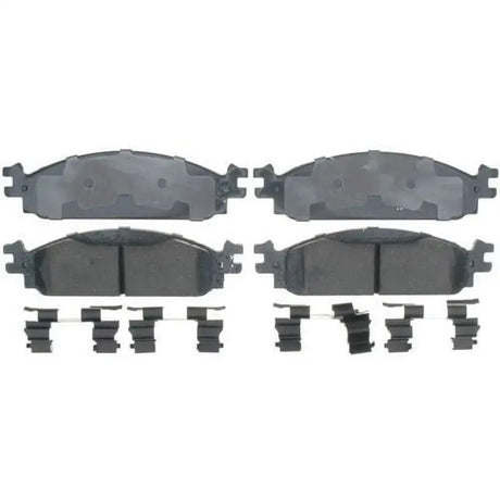 Four brake pads with clips for Raybestos Disc ROTR brake system replacement