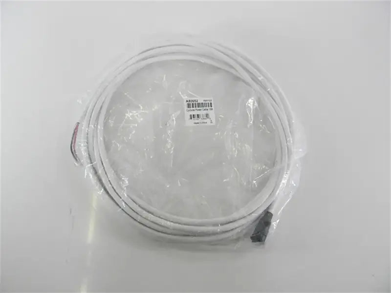Coiled white Raymarine Cyclone radar power cable in plastic packaging for A80652