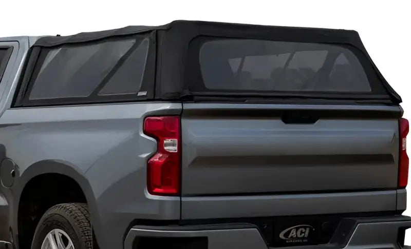 Gray pickup truck with black soft folding truck topper for Chevy GMC 1500 models