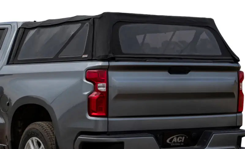 Gray pickup truck with black soft-top camper shell, perfect soft folding truck topper for Chevy GMC