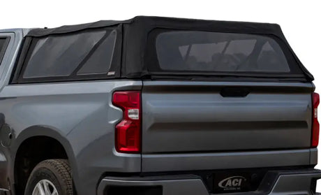 Gray pickup truck with black soft-top camper shell, perfect soft folding truck topper for Chevy GMC
