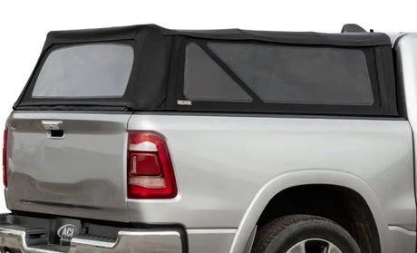 Silver pickup truck with black soft-shell truck cap for Toyota Tacoma soft folding topper