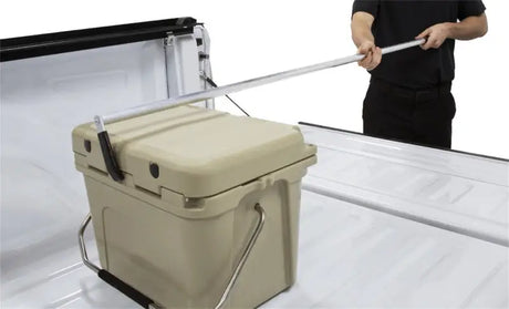 Tan cooler with metal handles for truck bed cargo reaching in Access Accessories EZ-Retriever II