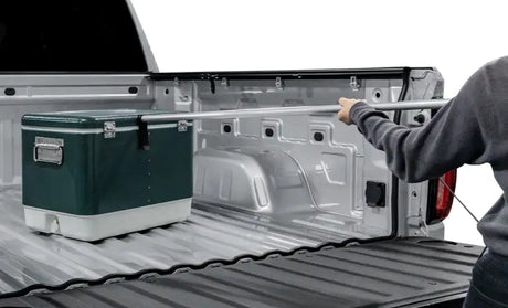 Green and white cooler in truck bed with Access Accessories EZ-Retriever II cargo reaching tool