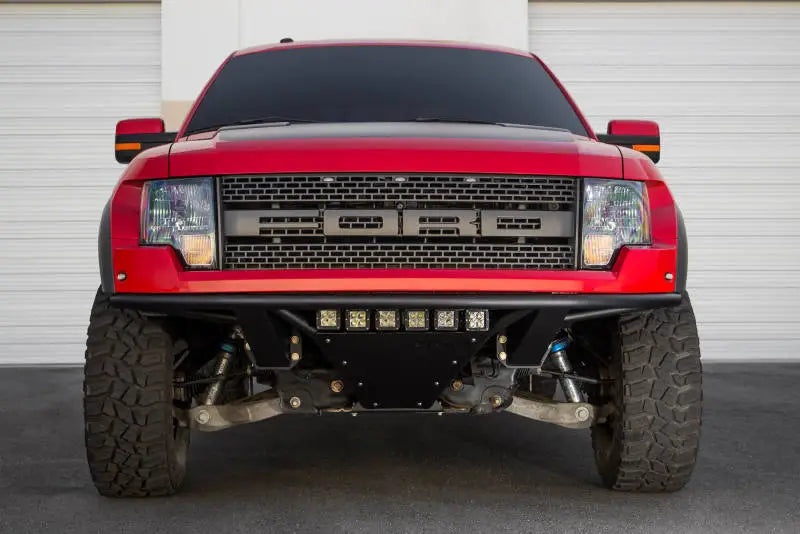 Red Ford Raptor front view with Addictive Desert Designs ADD PRO Front Bumper