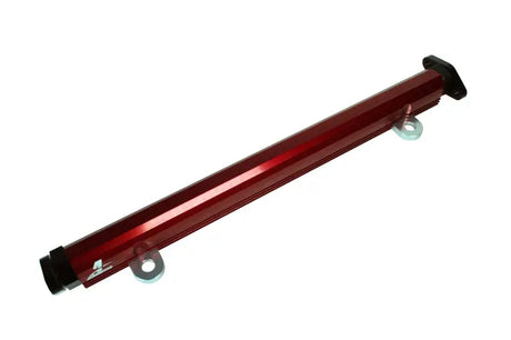 Red billet fuel rail with black end caps from Aeromotive Evo fuel rail kit