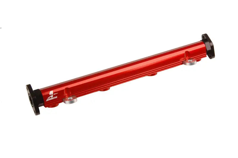 Red billet fuel rail with black end caps from Aeromotive Evo Billet Fuel Rail Kit