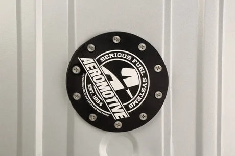 Black circular fuel system component for Aeromotive 55-57 Chevrolet Stealth Gen 2 fuel tank