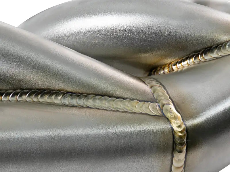 Welded metal pipes from aFe Twisted Steel for Ford Diesel V8 trucks under aFe Twisted