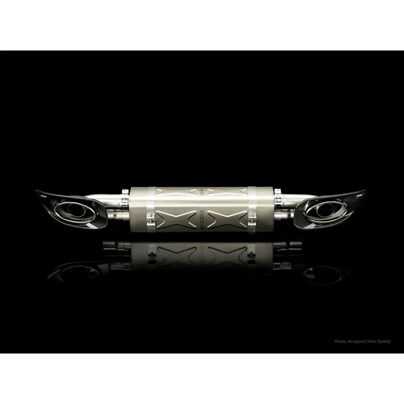 Silver motorcycle exhaust system with titanium tips from Akrapovic slip-on line for Porsche 911