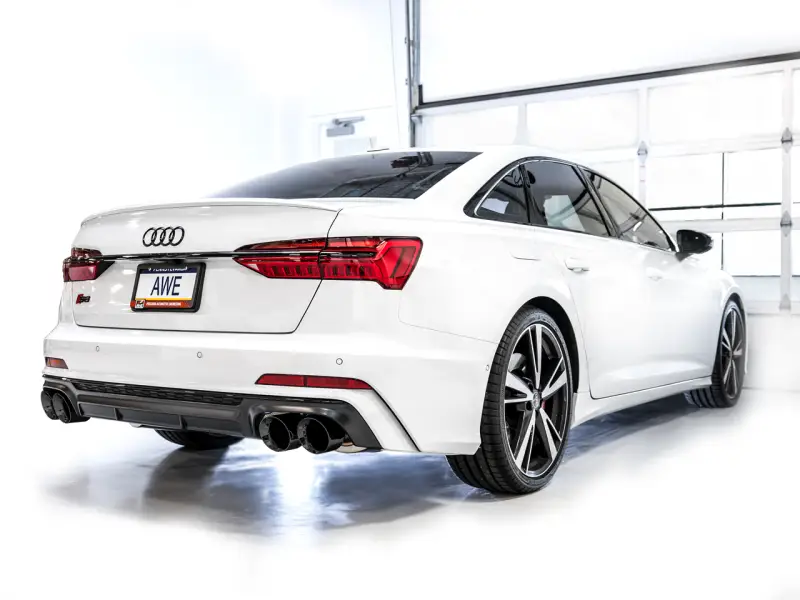 White Audi S6 sedan with AWE Tuning track edition exhaust and Diamond Black Tips