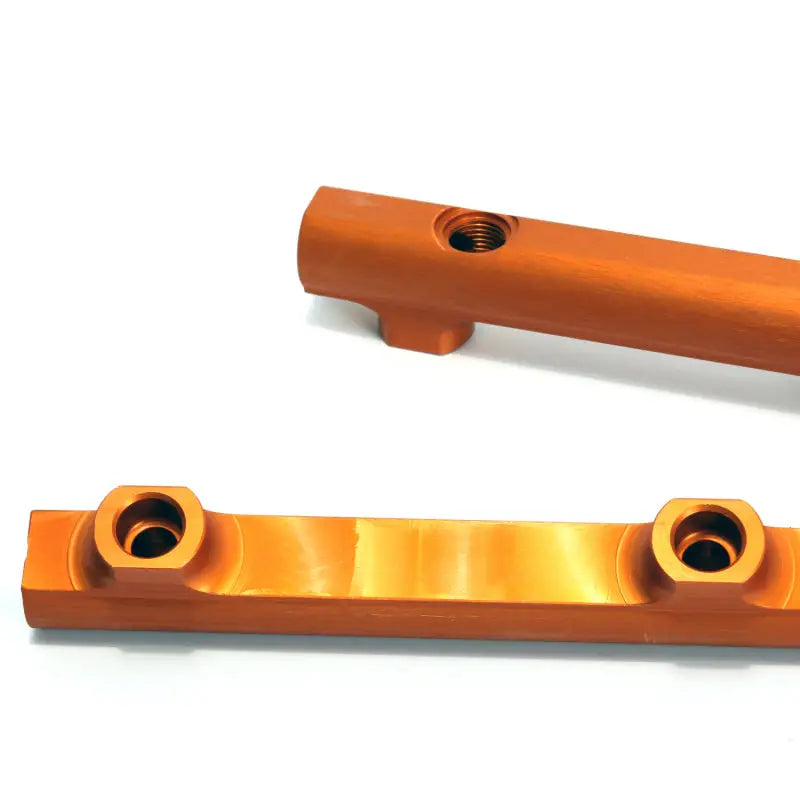 Orange anodized metal fuel rail kit with threaded holes for Dodge Hemi engines
