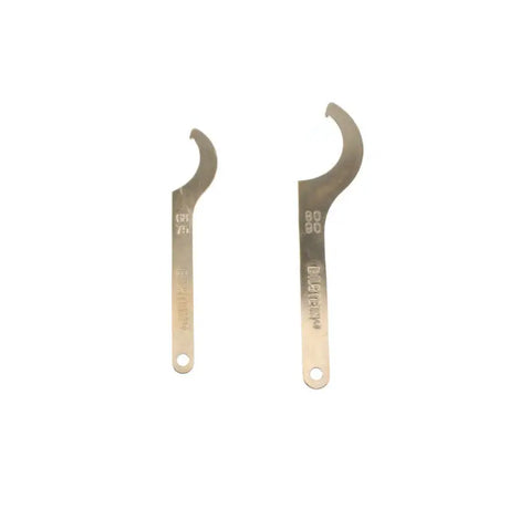 Two silver crescent wrenches for Porsche Boxster Bilstein B16 performance suspension