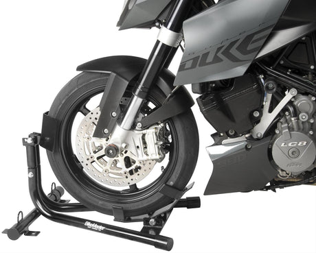 BikeMaster Universal Steel Roll-On Stand - 151573 holding a motorcycle securely by its front wheel.