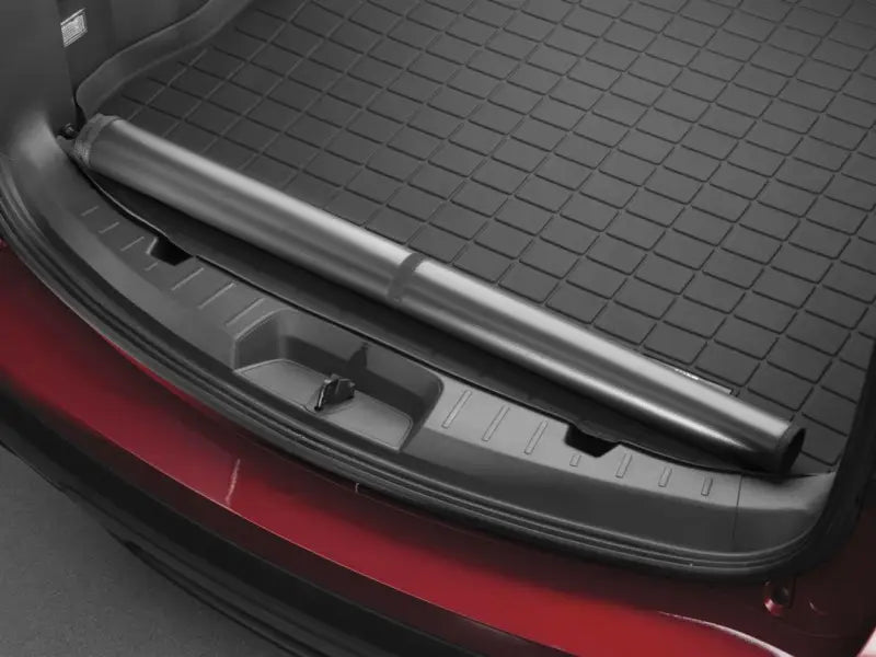 Retractable cargo cover for cargo area liner with raised edges in black TPE material