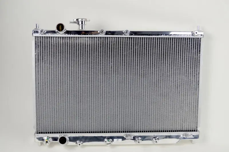 Silver aluminum Honda S2000 radiator for improved cooling and performance