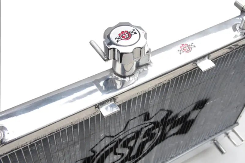 Shiny metal Chevrolet Camaro V8 radiator with cap, perfect for Camaro V8 radiator upgrade
