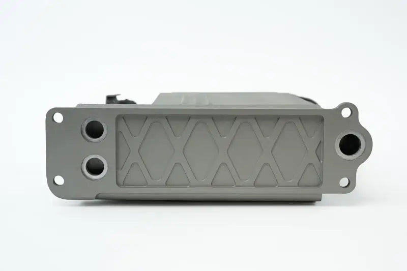 Gray metal engine oil cooler block with patterned surface and widemouth fitting for Porsche