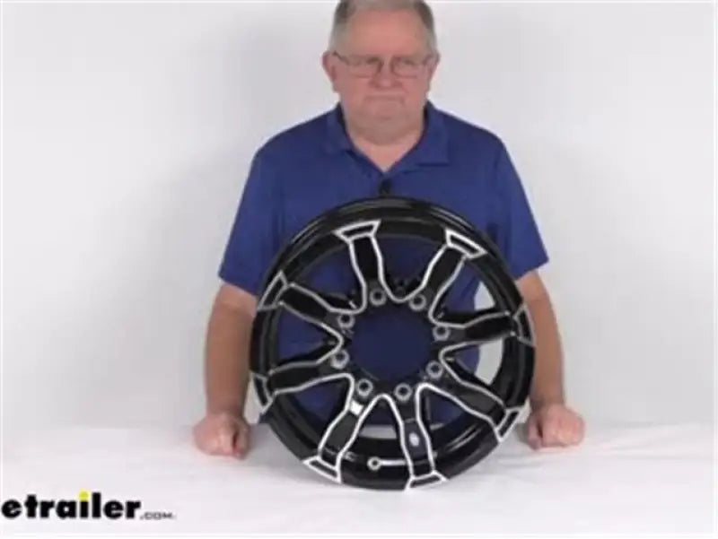 Black and silver trailer wheel with CXF105B Taskmaster Cap fits 16X tires