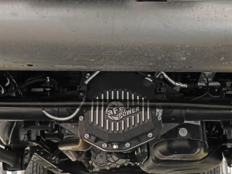 Black dielectric cover with cooling fins for Dana M220 with magnetic drain plug