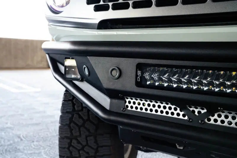 DV8 Offroad Competition Series Front Bumper for 21-22 Ford Bronco with steel skid plate, close-up view.