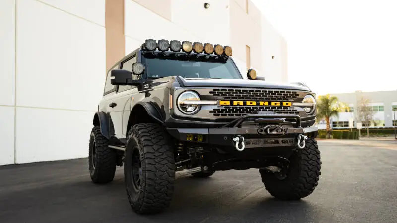 DV8 Offroad 21-23 Ford Bronco Spec Series Front Bumper with winch mount, tubular bull bar, and light mounts