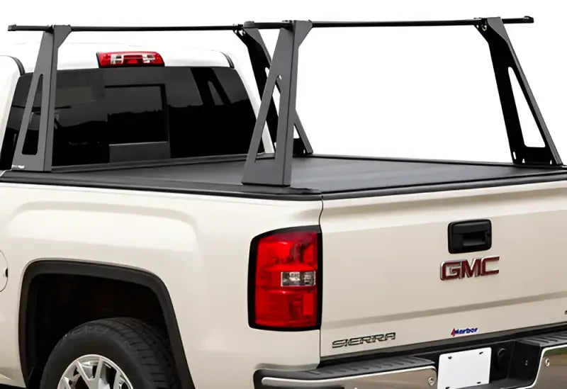 White GMC Sierra truck bed with black cover and ladder rack for ELC0401 Pace Edwards