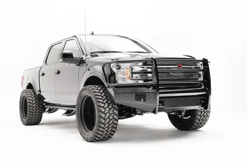 Fab Fours FF18-K4560-1 front bumper on Ford F150, showcasing rugged off-road style and added front-end protection.