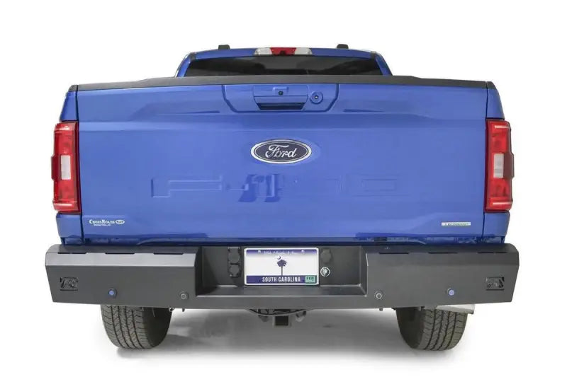 Blue Ford pickup truck with Fab Fours Red Steel Rear Bumper FF21-RT5150-1