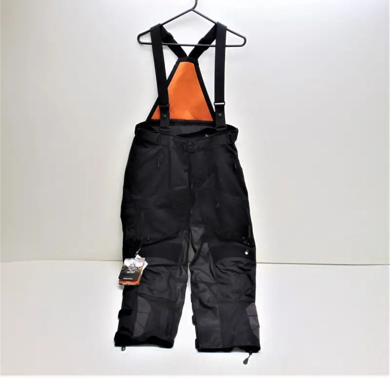 Black waterproof rogue XC Pro pants with bright orange lining and adjustable suspenders