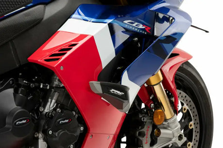 Red, white, and blue sport motorcycle with crash protectors for frame sliders RV parts