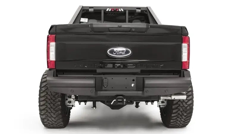 Fab Fours FS17-U4150-1 rear bumper on Ford F250/350, showcasing sleek design and durable construction for superior protection.