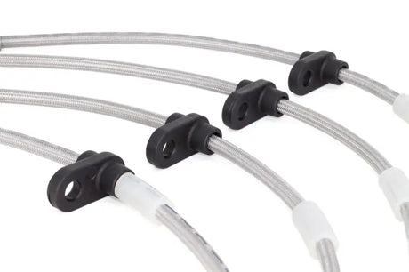Braided stainless steel brake lines with black brackets for improved vehicle’s braking performance