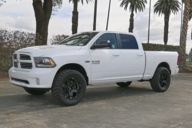 2009-2018 Ram 1500 4WD equipped with ICON Vehicle Dynamics Stage 2 Suspension System featuring 2.5” coilover shocks and Eibach coil springs for improved performance and ride quality.