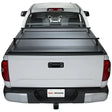 White pickup truck with bed cover featuring KRF171 Pace Edwards Ultragroove Kit