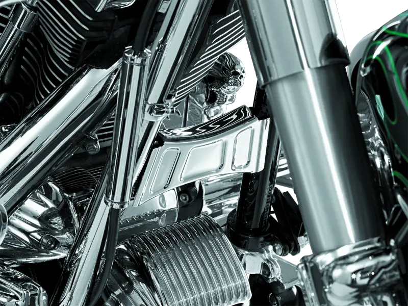 Chrome motorcycle engine detail showcasing Kuryakyn Downtube Cross Brace Cover 99-13 Touring