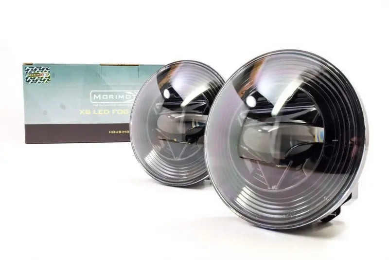 LF111 Morimoto Xb LED Fogs Type GM Pair with box packaging showcasing advanced Morimoto Xb LED technology for enhanced vehicle fog light performance and aesthetic.