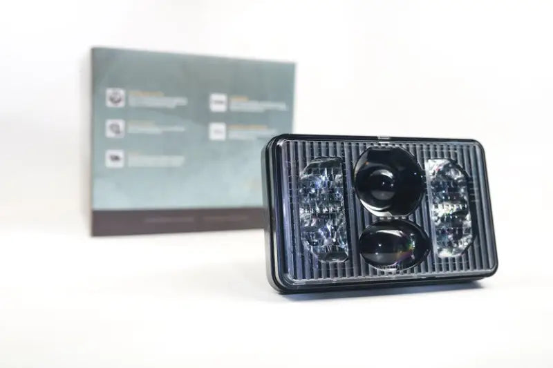 LF267 Morimoto Sealed Beam: Morimoto Sealed4 (4X6) headlight in front of product packaging box, showcases advanced illumination technology for vehicles.