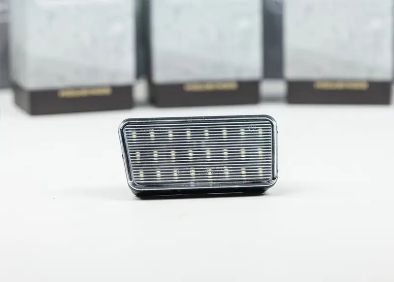 Rectangular LED license plate light with chrome trim for Wrangler LFZ17 Morimoto XbLd