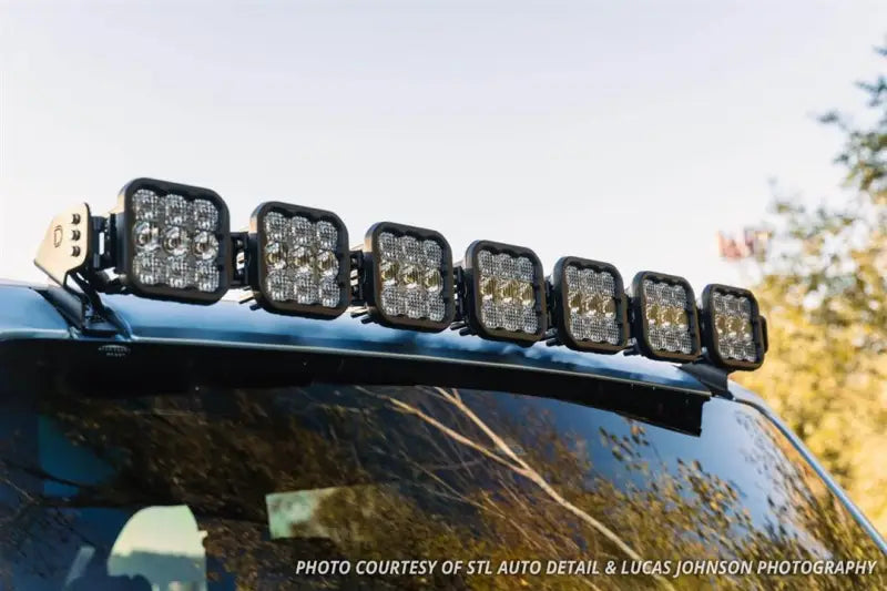 Roof-mounted LED light bar for trucks with driving and flood combo beams and black housing