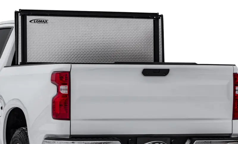 White pickup truck with lomax stance hard textured silver tonneau cover on Ford F-150