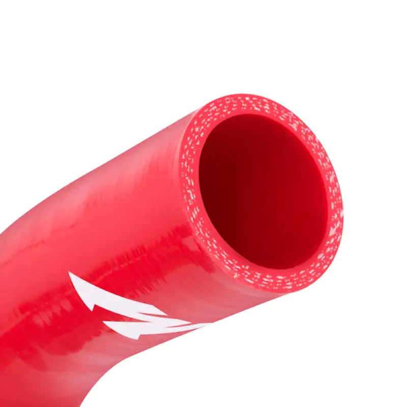 Red silicone coolant hose with white arrows from Mishimoto 01-03 Ford 7.3L hose kit