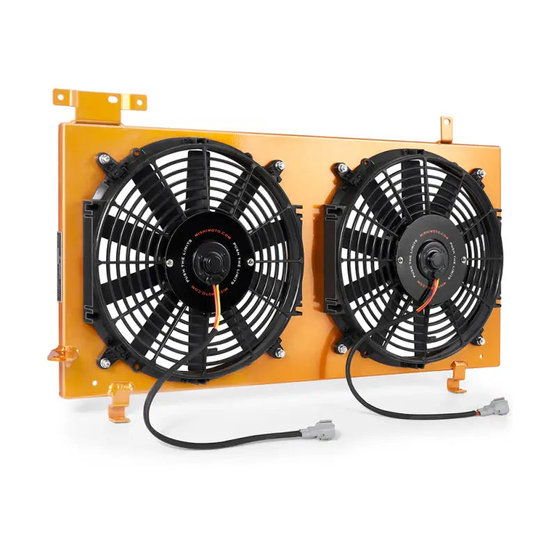 Dual electric fan assembly in Mishimoto Subaru WRX STI aluminum fan shroud gold