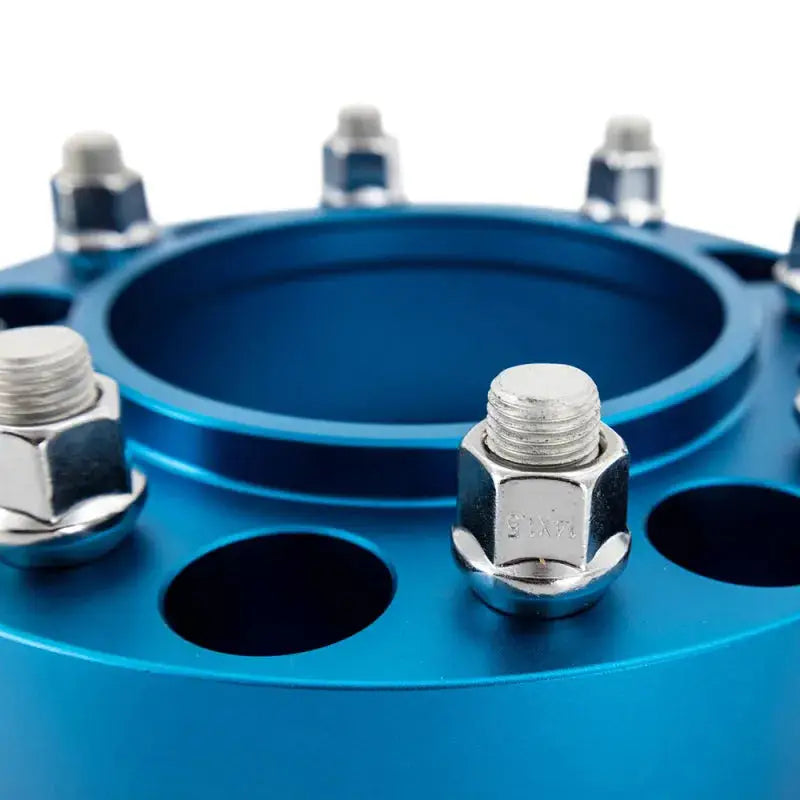 Blue Mishimoto Borne wheel spacers with lug nuts and hub bore for 5x150 vehicles