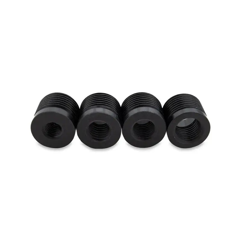 Four black Mishimoto XL shift knob thread adapters for easy shift knob installation