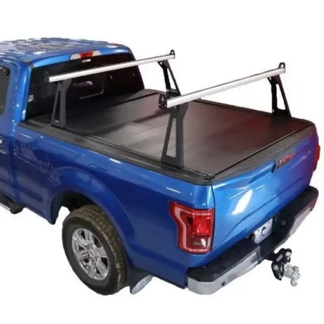 Blue pickup truck with bed rack.