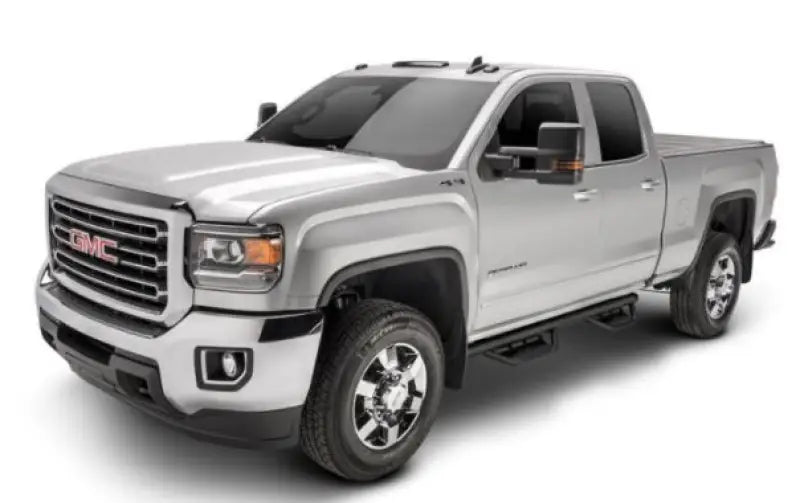 Silver GMC pickup truck with matte black stainless nerf bar and drop down steps